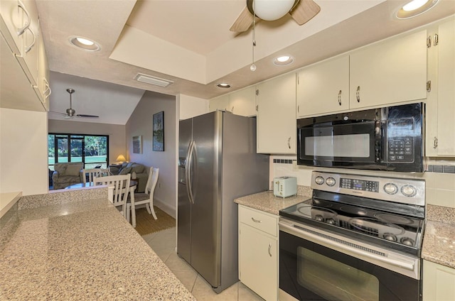 kitchen with ceiling fan, vaulted ceiling, decorative backsplash, light tile patterned flooring, and appliances with stainless steel finishes