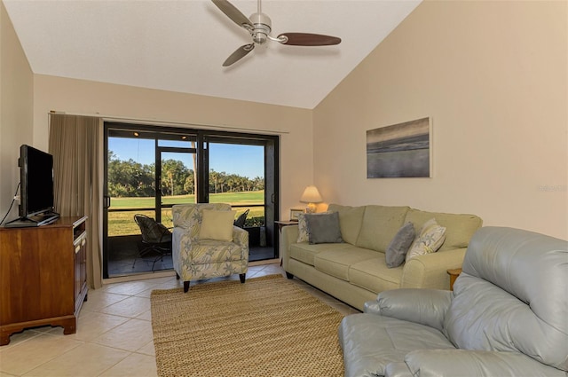 tiled living room with ceiling fan and high vaulted ceiling