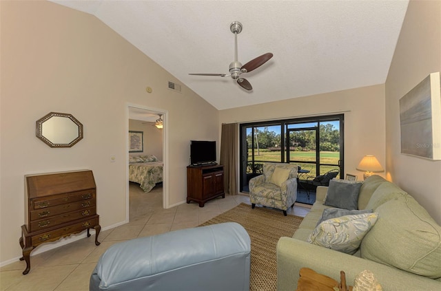 living room with light tile patterned floors, a textured ceiling, vaulted ceiling, and ceiling fan