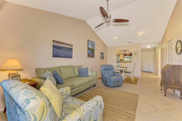 tiled living room featuring ceiling fan and lofted ceiling