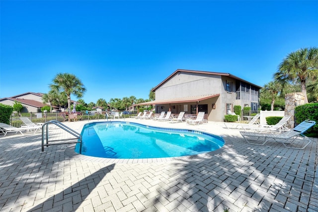 view of swimming pool with a patio