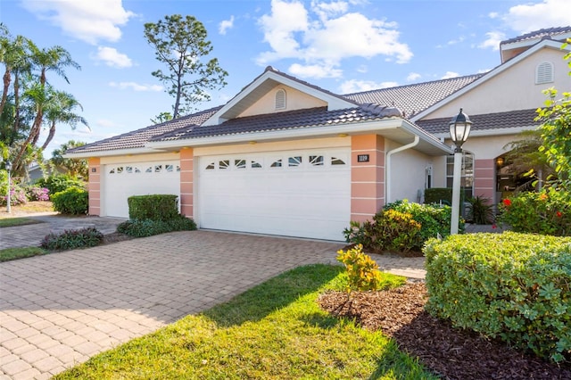 ranch-style house featuring a garage