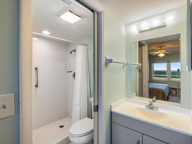 bathroom featuring a shower with shower curtain, ceiling fan, toilet, and vanity