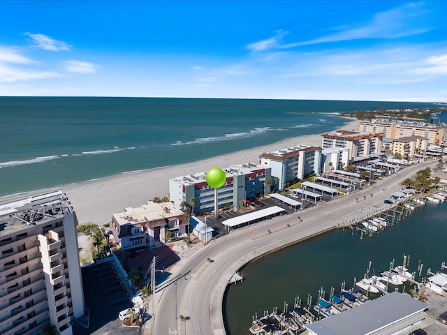 drone / aerial view featuring a water view and a beach view