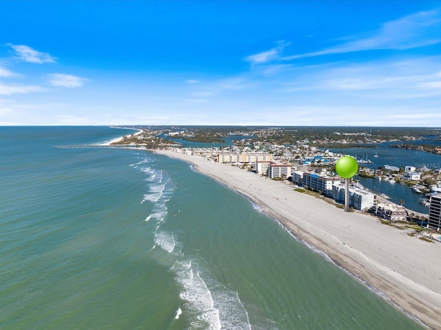 drone / aerial view featuring a water view and a beach view