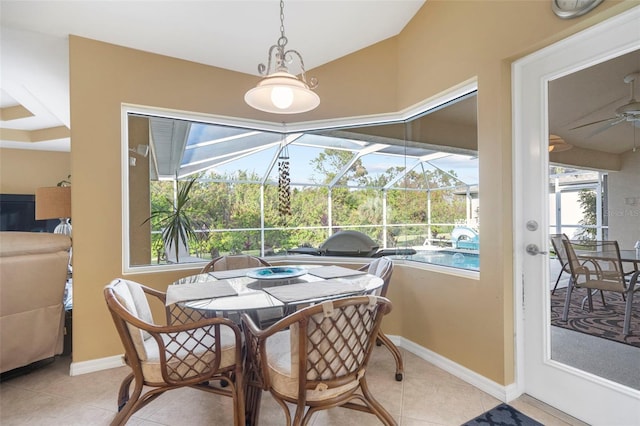 tiled dining area featuring a wealth of natural light and ceiling fan