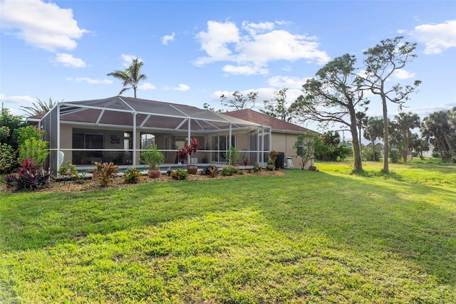150 Marker Rd, Rotonda West, FL 33947 - back of house with a lawn and glass enclosure