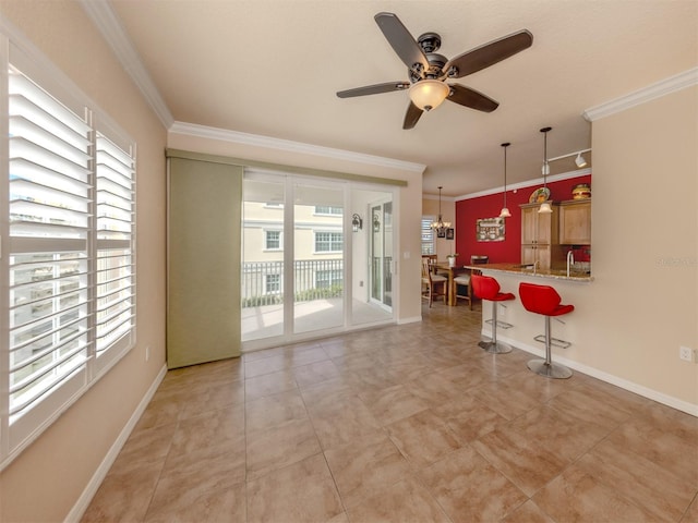 interior space with ceiling fan with notable chandelier and ornamental molding