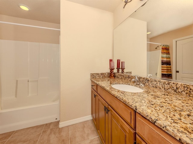 bathroom with shower / bath combo, vanity, and tile patterned floors