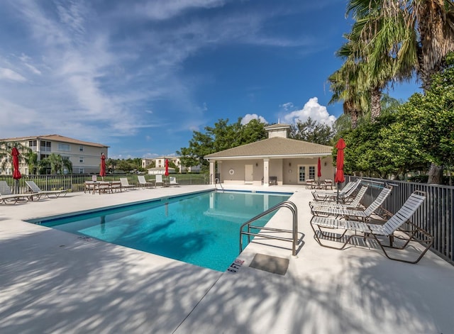 view of swimming pool with a patio