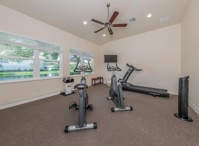 exercise room featuring ceiling fan and vaulted ceiling