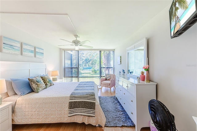 bedroom with ceiling fan, access to exterior, and light hardwood / wood-style flooring