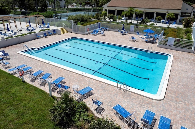 view of swimming pool featuring a patio area