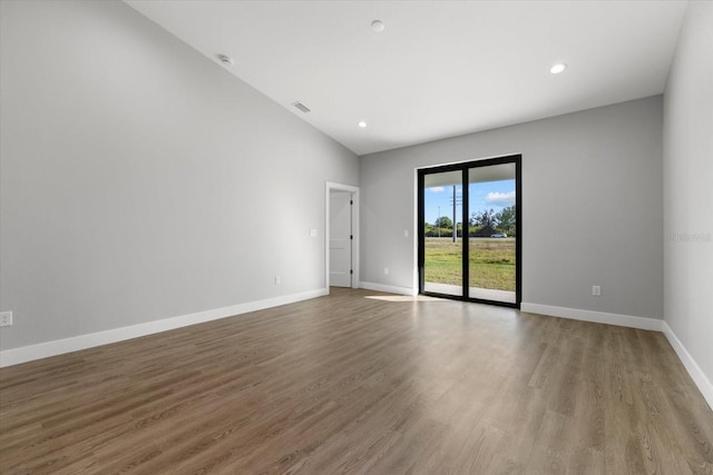 empty room featuring hardwood / wood-style flooring