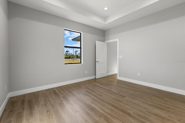 spare room with hardwood / wood-style flooring