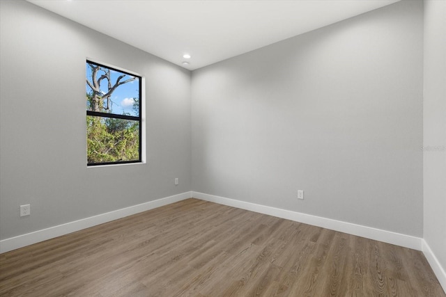 spare room featuring hardwood / wood-style flooring