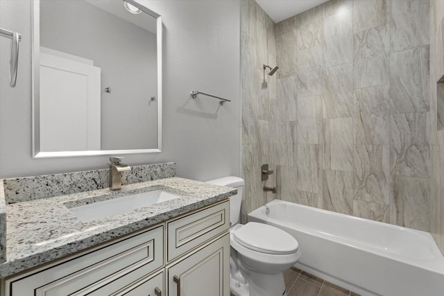 full bathroom with vanity, tiled shower / bath, and toilet