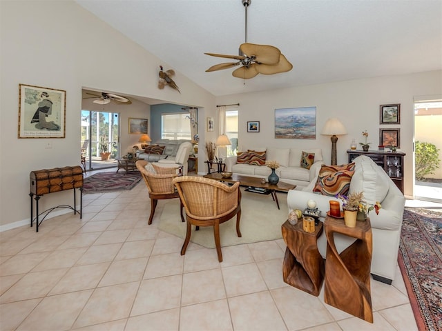 living room with light tile patterned floors, high vaulted ceiling, and ceiling fan