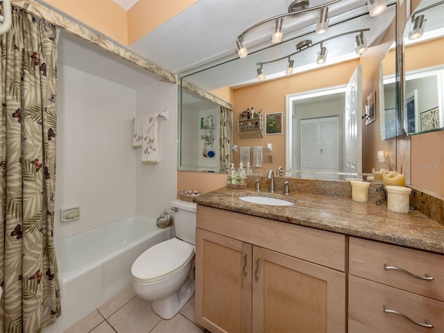 full bathroom with tile patterned floors, vanity, toilet, and shower / bath combo with shower curtain