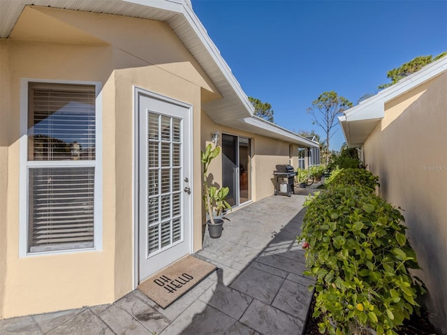 entrance to property with a patio