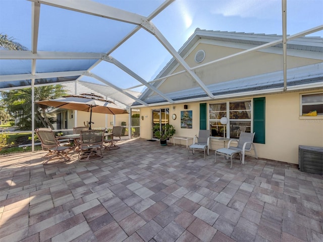 view of patio / terrace with a lanai