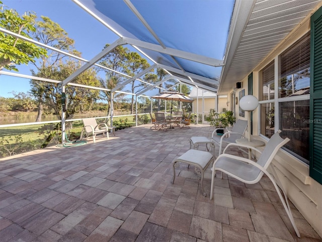 view of patio / terrace featuring glass enclosure