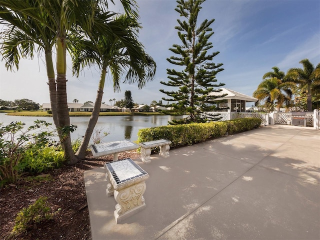 view of patio with a water view