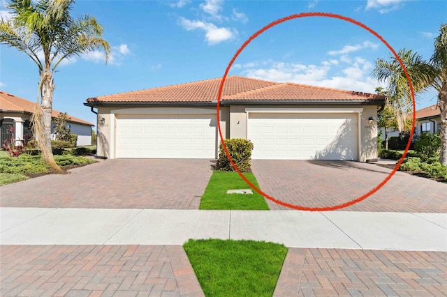 view of front of property featuring a garage