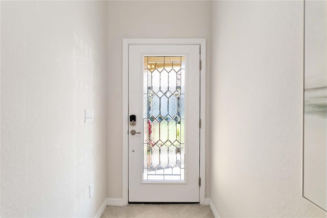 doorway with light tile patterned flooring