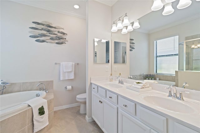 bathroom with vanity, tile patterned floors, crown molding, toilet, and tiled tub