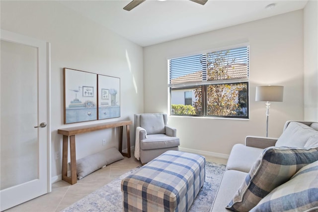 sitting room featuring ceiling fan and light tile patterned floors