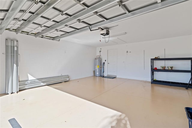 garage featuring electric water heater and a garage door opener