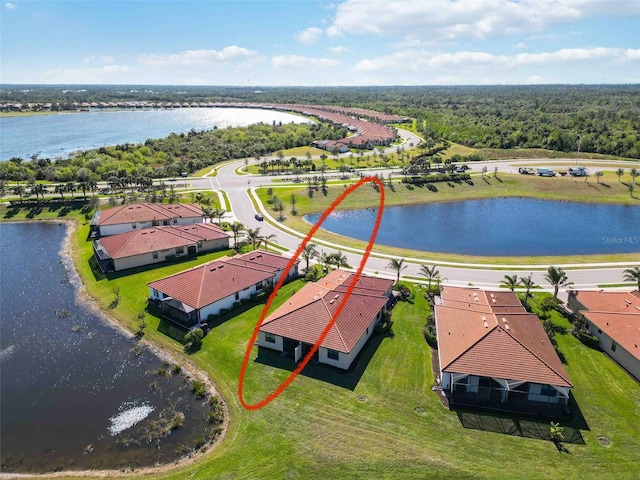 birds eye view of property featuring a water view