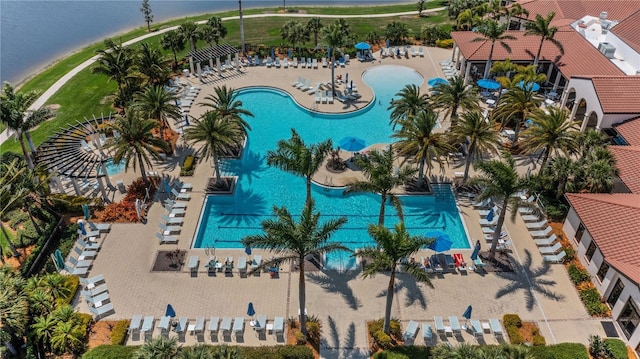 birds eye view of property with a water view