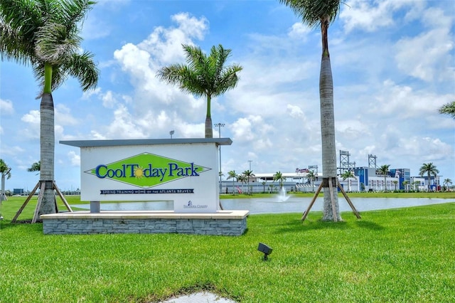 exterior space featuring a water view and a yard