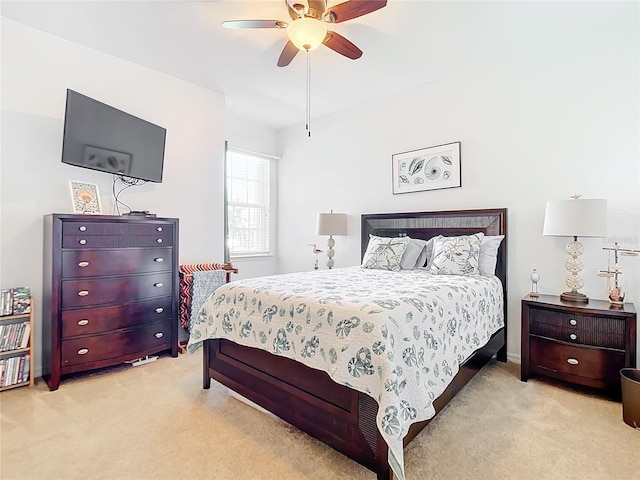 bedroom featuring light colored carpet and ceiling fan