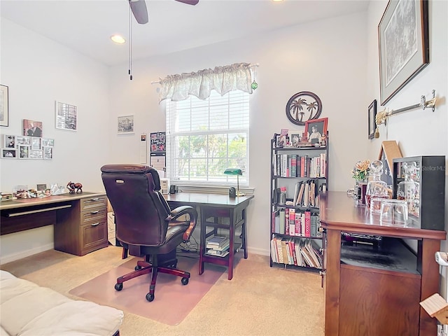 carpeted office with ceiling fan