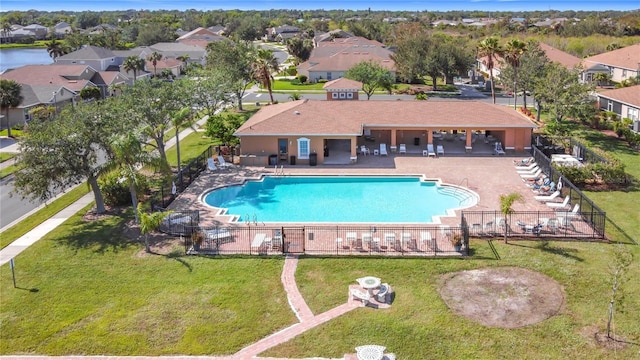 view of swimming pool with a yard and a patio