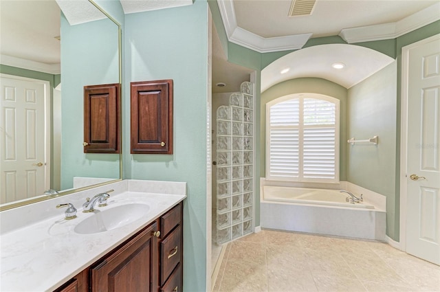 bathroom featuring visible vents, crown molding, vanity, and a bath