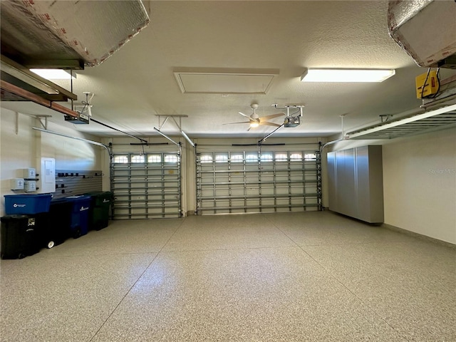 garage with baseboards and a garage door opener