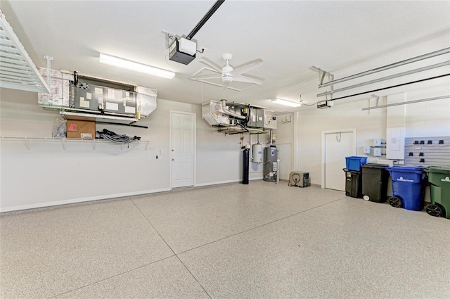 garage featuring water heater, baseboards, and a garage door opener