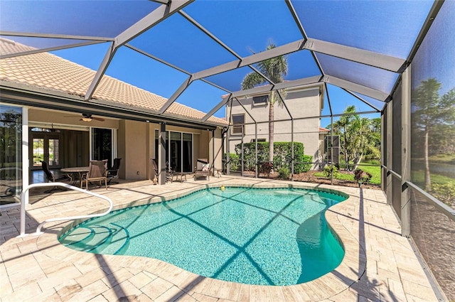 pool with a patio area and a lanai