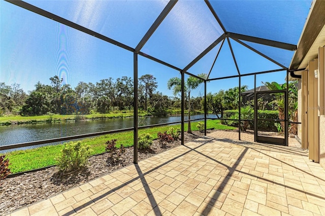 unfurnished sunroom with a water view