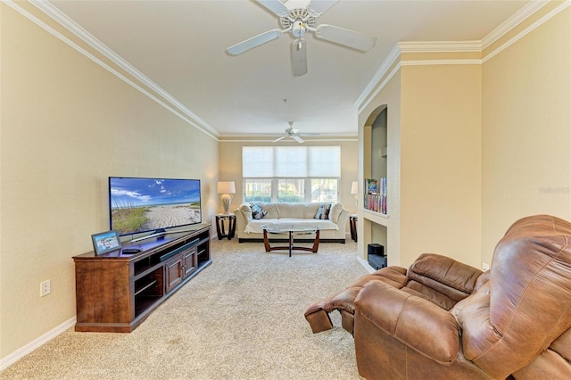 living room featuring light carpet, ceiling fan, and crown molding