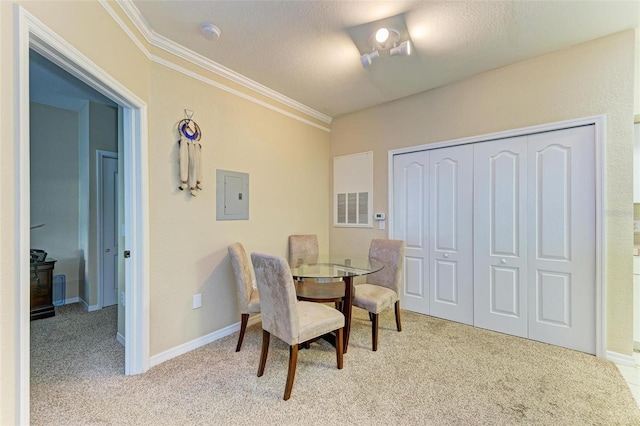 carpeted dining area featuring a textured ceiling, crown molding, and electric panel