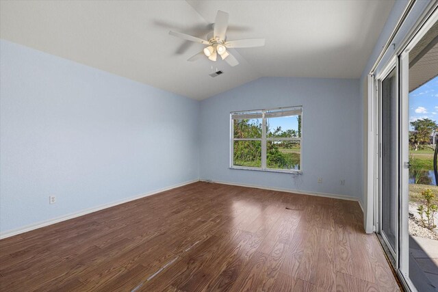 empty room featuring hardwood / wood-style floors, ceiling fan, and lofted ceiling