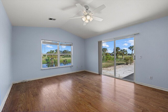 empty room featuring wood-type flooring, ceiling fan, and lofted ceiling