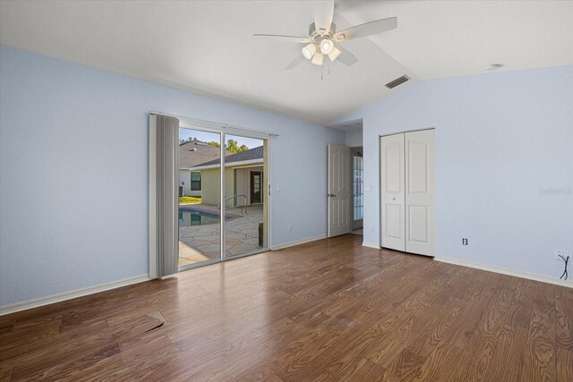 unfurnished room with ceiling fan, wood-type flooring, and vaulted ceiling