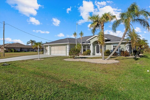 ranch-style home featuring a garage and a front lawn