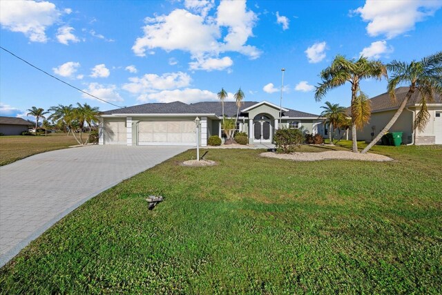 single story home with a front yard and a garage